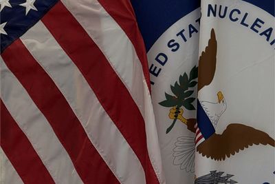 The United States flag beside the Nuclear Regulatory Commission flag, where the 24th Software Certification Consortium met